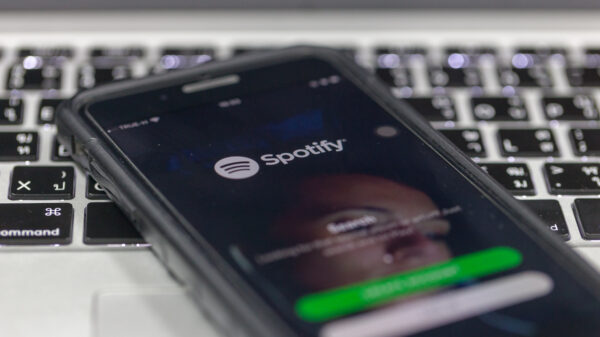 Spotify, company behind Spotify Wrapped, app on phone