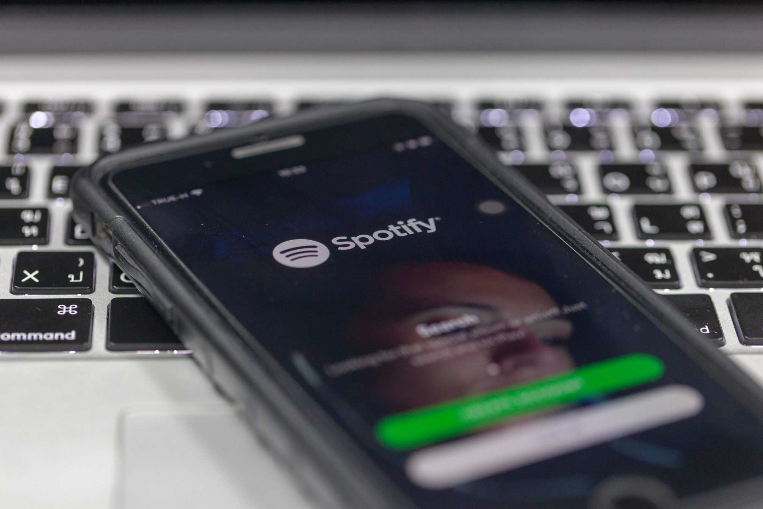 Spotify, company behind Spotify Wrapped, app on phone